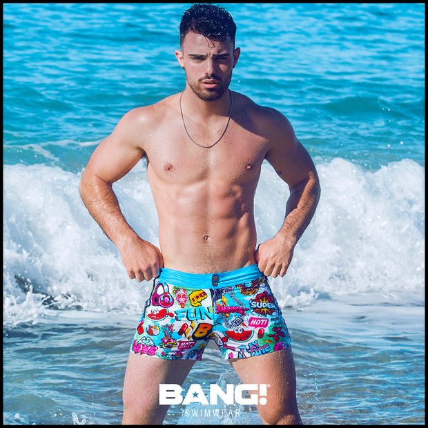 sexy male model on the miami beach wearing a perfect fit bang clothes beach short with popping colors gay designer premium quality