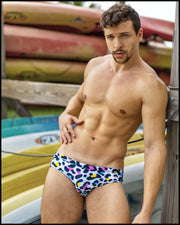 Front view of a sexy male model wearing BANG Miami premium swim briefs 8-bit collection designer quality premium sexy gay