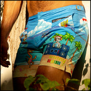 Side view of model wearing the HEY MISTER TJ (POOLSIDE MIX) Men’s shorts for the beach by Bang! Miami, with white background.