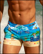 View of a man wearing the 8-BIT WILD BEACH PARTY shorter leg length swim trunks by Bang! Clothes with 80s Sega video game graphics.