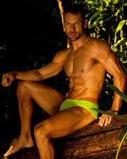 The Ultra Neon Brazilian Swim Sunga for men by BANG Clothing Miami in neon yellow fluo green color.