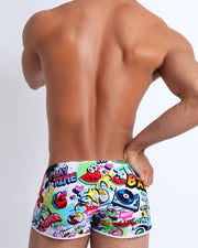 Back view of a sexy male model wearing men’s swimwear made by the Bang! official brand of men's beachwear.