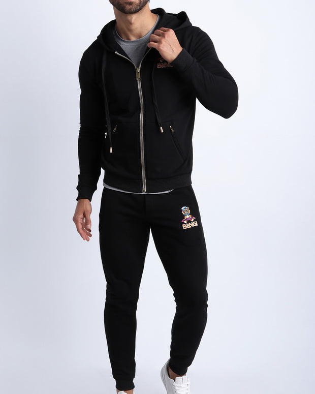 Frontal view of the matching BLACK Tracksuit Hoodie Jacket and the Tracksuit Pants for men in a soft moisture wicking and breathable tracksuit set. 