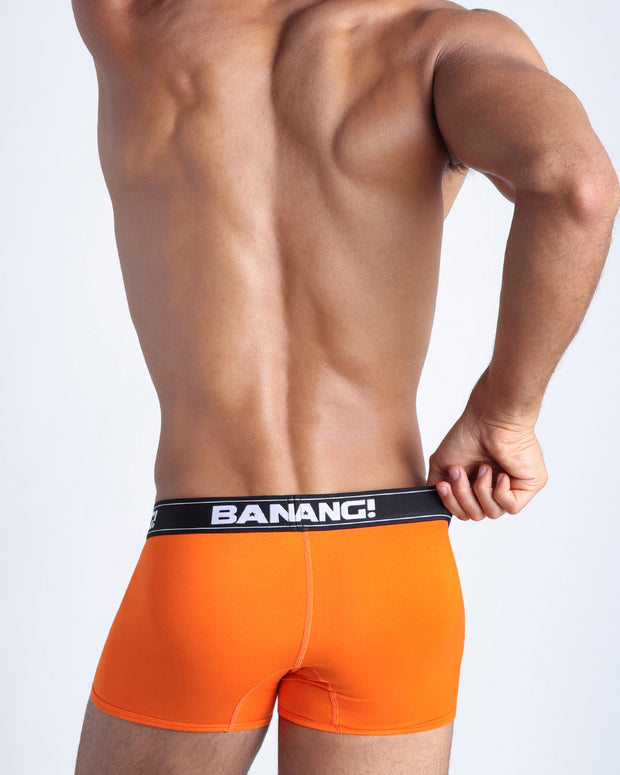Back view of model wearing the BLAZE ORANGE Men’s beathable cotton boxer briefs  for men by BANG! Underwear trunks provide all-day comfort and secure fit.