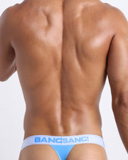 Male model wearing the ANGEL BLUE premium soft cotton thong by BANG! Clothes. Offers a silky feeling in contact with skin and natural breathability. 