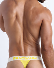 Back view of BANGNANARAMA men's cotton thong underwear in a yellow color offering a perfect fit. This Thong is the ideal choice when you want to avoid visible underwear lines. Made by the Bang! mens brand from Miami.