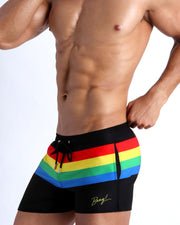 Side view of the FOUR EVER STRIPES VOL 1 swim trunks for men in dark black with stripes in red, yellow, blue and green by Bang! Clothing of Miami.