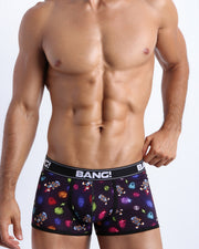 Front view of a sexy male model wearing a BANG! Cotton Boxer Briefs for men in black with headphones and vynil disc. Offers stay-put leg design that prevents chafing and riding up the leg. 