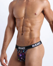 Side view of model wearing the HEY MISTER TJ (CLUB MIX)  in a fun and bright plaid with dinosaurs soft cotton underwear for men by BANG! Clothing the official brand of men's underwear.