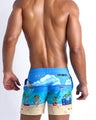 Back view of the 8-BIT WILD BEACH PARTY beach shorts for men by BANG! menswear Miami with pixelated sprite graphics of Atari video game, Nintendo, Sega, Commodore 64