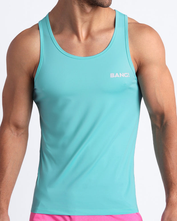 Frontal view of male model wearing the CELESTIAL BLUE in a solid light aqua gym tank top for men by the Bang! brand of men&
