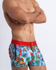 Side side view of a sexy in-shape men's torso wearing DISCO JUNGLE shorts swimsuit by the Bang! brand of menswear from Miami. 