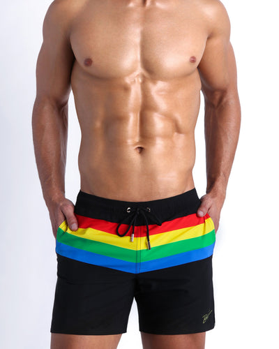 Frontal view of male model wearing the FOUREVER STRIPES VOL 1 men's premium quality swimwear bottoms by the Bang! Clothes brand of men's swimwear from Miami.