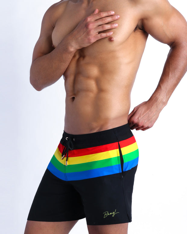 Side view of the FOUREVER STRIPES VOL 1 Summer resort shorts with dual pockets men in dark black with stripes in red, yellow, blue and green by Bang! Clothing of Miami.