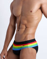 Side view of the FOUR EVER STRIPES VOL 1 Summer swimsuit for men in dark black with stripes in red, yellow, blue and green by Bang! Clothing of Miami.