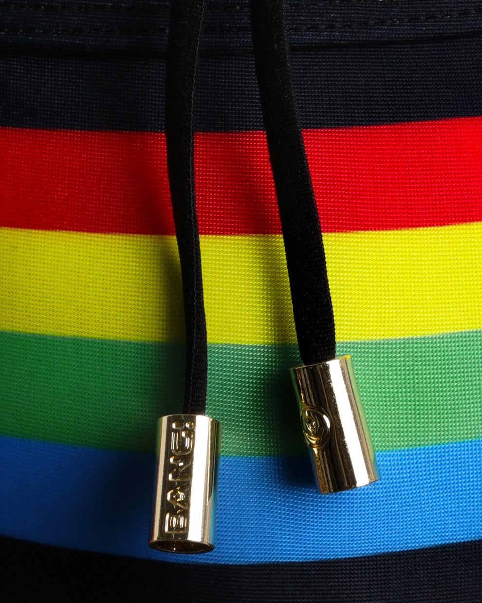 Close-up view of inseam and details of FOREVER STRIPES VOL 1 swimsuit for men, with black cord and custom branded golden cord-ends, and matching custom eyelet trims in gold.