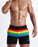 Male model wearing the FOUREVER STRIPES VOL 1 men's beach tailored shorts by the Bang! Clothes brand of men's swimwear from Miami.