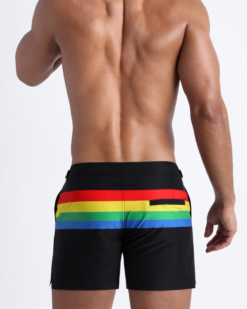 Back side of the FOREVER STRIPES VOL 1 men’s beach trunks in black with colored bands in green, red, yellow and blue by Bang! Miami.