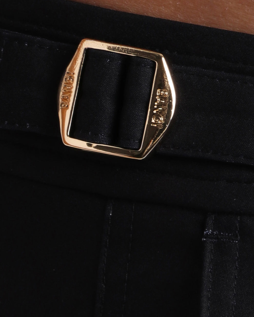 Close-up view of the FOUREVER STRIPES VOL 1 men’s swimwear, showing custom branded golden adjustable side buckles.