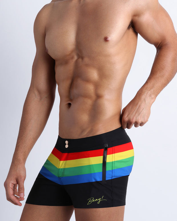 Side view of the FOUR EVER STRIPES VOL 1 Summer swimsuit for men in dark black with stripes in red, yellow, blue and green by Bang! Clothing of Miami.