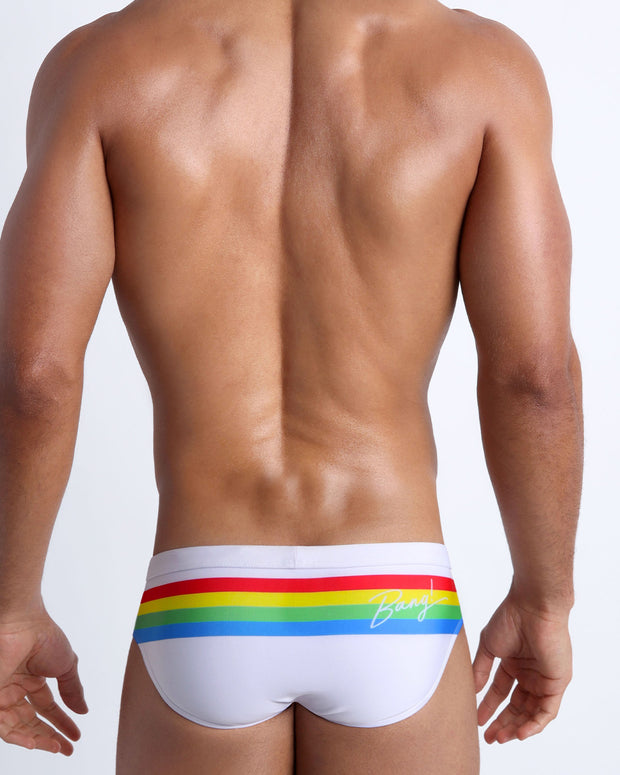 Back side of the FOREVER STRIPES VOL 2 men’s beach briefs in white with colored bands in green, red, yellow and blue by Bang! Miami.