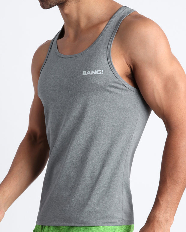 Side view of men’s fitness tank top in dark stone grey color made by BANG! Clothing the official brand of mens beachwear. 