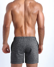 Back view of the GROOVEJET men's fitness sweatshorts in a dark heather grey color by BANG! menswear Miami.