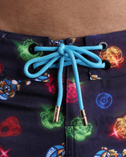 Close-up view of men’s summer beach shorts by BANG! clothing brand, showing blue cord with custom branded golden cord ends, and matching custom eyelet trims in gold.