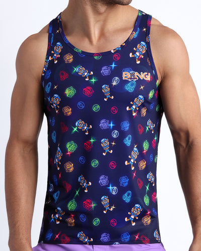 Frontal view of model wearing the HEY MISTER TJ (CLUB MIX) Men’s beach tank top in dark tones with colorful headphones and disc shapes and a dj tiger print.