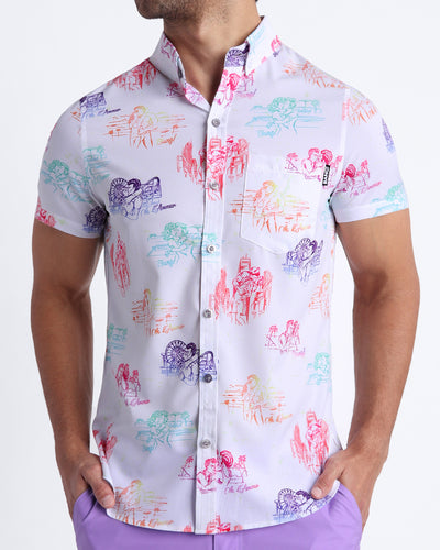 Frontal view of sexy male model wearing OH L'AMOUR men’s short-sleeve stretch shirt in white with colorful scenes of iconic couples kissing and in love.