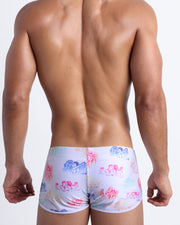 Back view of the OH L'AMOUR men’s beach swim shorts by BANG! inspired by 80s techno band erasure and Toile de Jouy scenes.