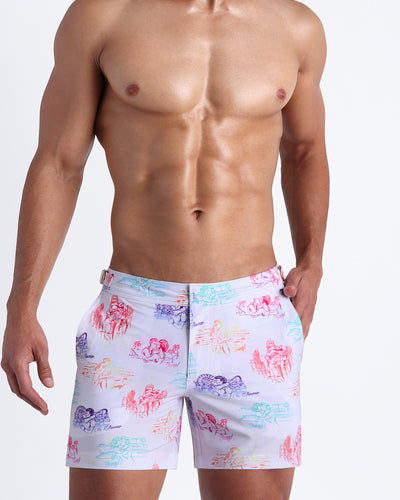 The OH L'AMOUR men’s beach tailored shorts in white with colorful scenes of iconic couples kissing and in love.