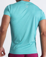 Back view of the OLYMPIC BLUE men's fitness shirt in a green blue color by BANG! menswear Miami.