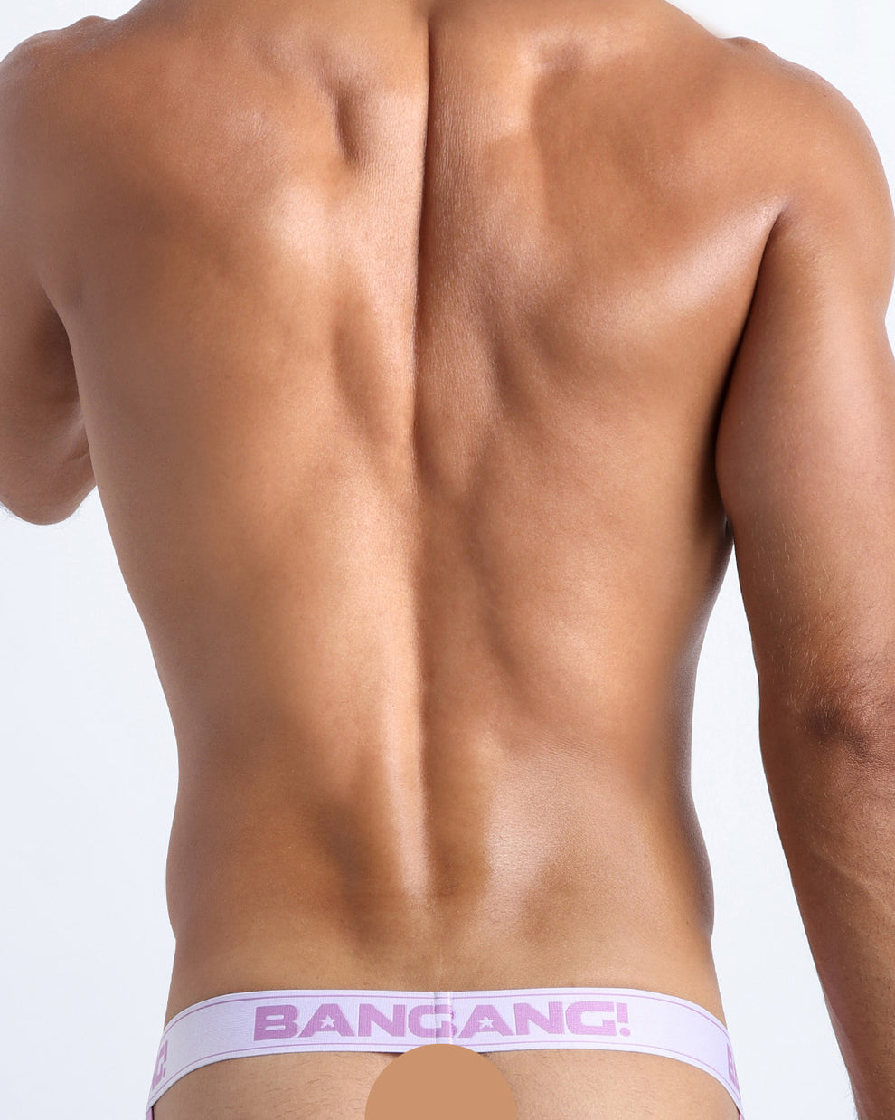 Back view of model wearing the PURPLE REIGN Men’s beathable cotton Jockstrap for men by BANG! Offers light compression for perfect contouring to the body and second-skin fit.