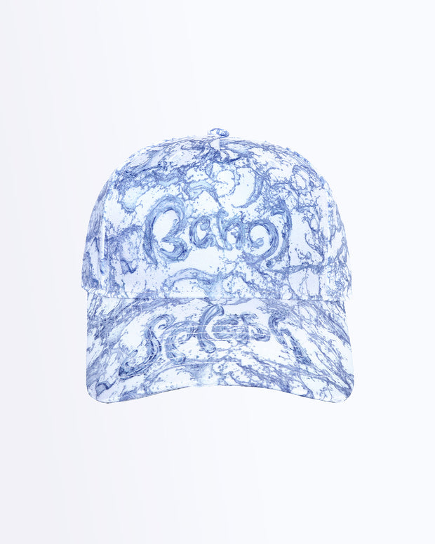 Frontal view of the SPLASH Baseball cap in white with blue water letters spelling BANG! logo. Distressed-effect details for a relaxed/worn in fit by BANG! Clothing based in Miami.