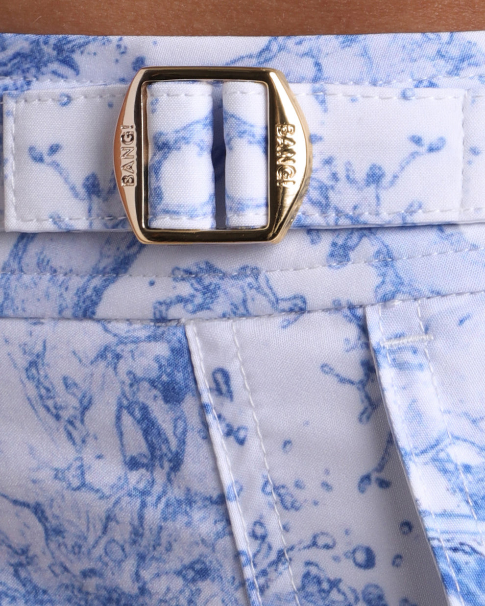 Close-up view of the SPLASH men’s swimwear, showing custom branded golden adjustable side buckles.