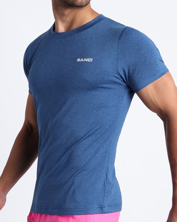 Side view of men’s exercise tee in a indigo blue color made by BANG! Clothing the official brand of mens beachwear. 