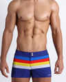 Frontal view of model wearing Stripe'A'Pose men’s swimwear by the Bang! Clothes brand of men's beachwear from Miami.