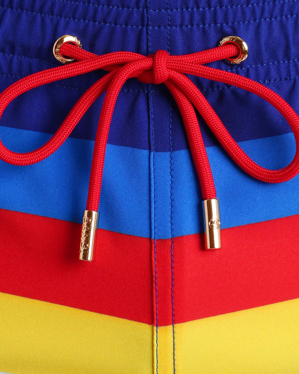 Close-up view of inseam and details of Stripe'A'Pose swimsuit for men, with red cord and custom branded golden cord-ends, and matching custom eyelet trims in gold.