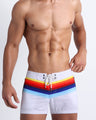Frontal view of male model wearing the STRIPES ON 45 men's beach flex shorts by the Bang! Clothes brand of men's swimwear from Miami.