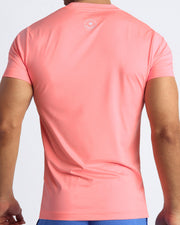 Back view of the TONED CORAL men's fitness shirt in a coral color by BANG! menswear Miami.