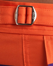 Close-up view of the STRIPE'A'POSE REMIX men’s summer shorts, showing custom branded golden adjustable side buckles.