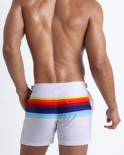 Back side of the STRIPES ON 45  men’s beach trunks in white with rainbow colored bands by Bang! 80s California Surfer Roller Skating culture
