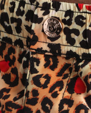 Close-up view of the CATS N'ROSES men’s summer shorts, showing custom branded metal button  in gold by Bang! Miami.
