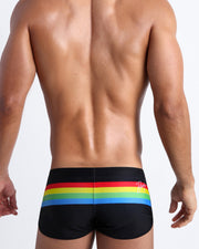 Back side of the FOREVER STRIPES VOL 1 beach swim shorts in black with colored bands in green, red, yellow and blue by Bang! Miami.
