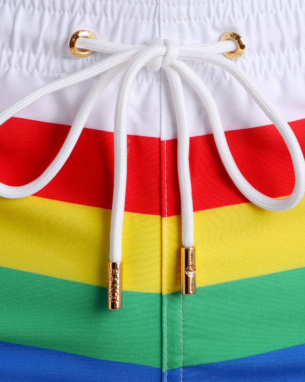 Close-up view of trims of FOREVER STRIPES VOL 2 swimsuit for men, with white cord and custom branded golden cord-ends, and matching custom eyelet trims in gold.