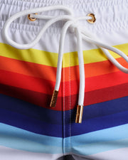 Close-up view of trims of STRIPES ON 45 swimsuit for men, with white cord and custom branded golden cord-ends, and matching custom eyelet trims in gold.