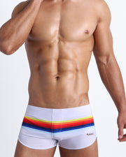 Male model wearing the STRIPES ON 45 men's swim bottoms by the Bang! Clothes brand of men's swimwear from Miami.