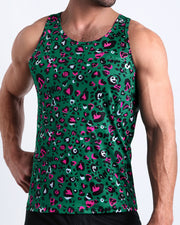Front view of model wearing the CAMO CHAMELEON men’s beach tank top in a forest green color with white and pink camo print by the Bang! Clothes brand of men's beachwear from Miami.
