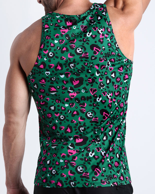 Back view of male model wearing the CAMO CHAMELEON summer tank top for men by BANG! Miami featuring in teal with pink and black animal print.